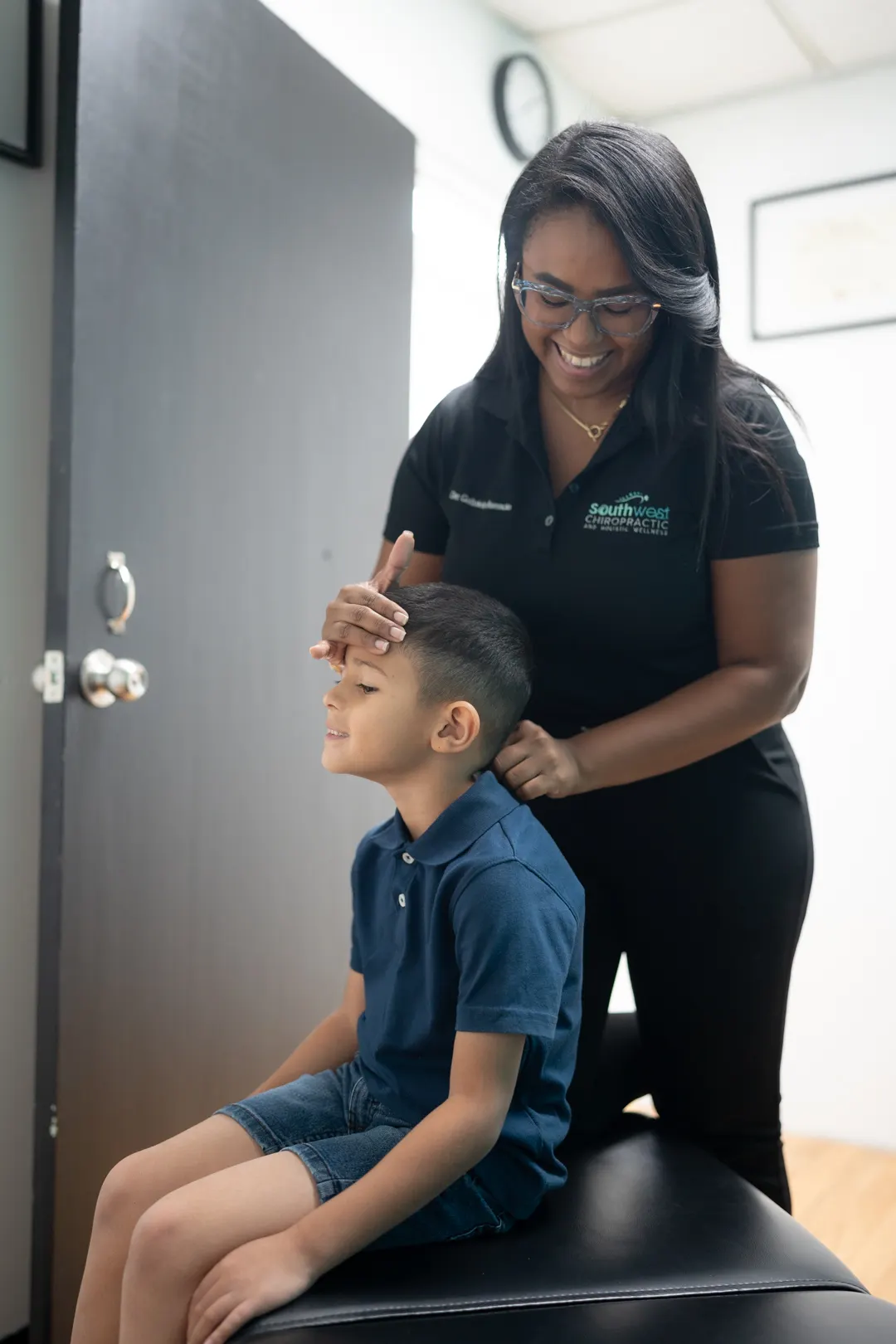 Dr. Gabriela reviewing spine X-rays